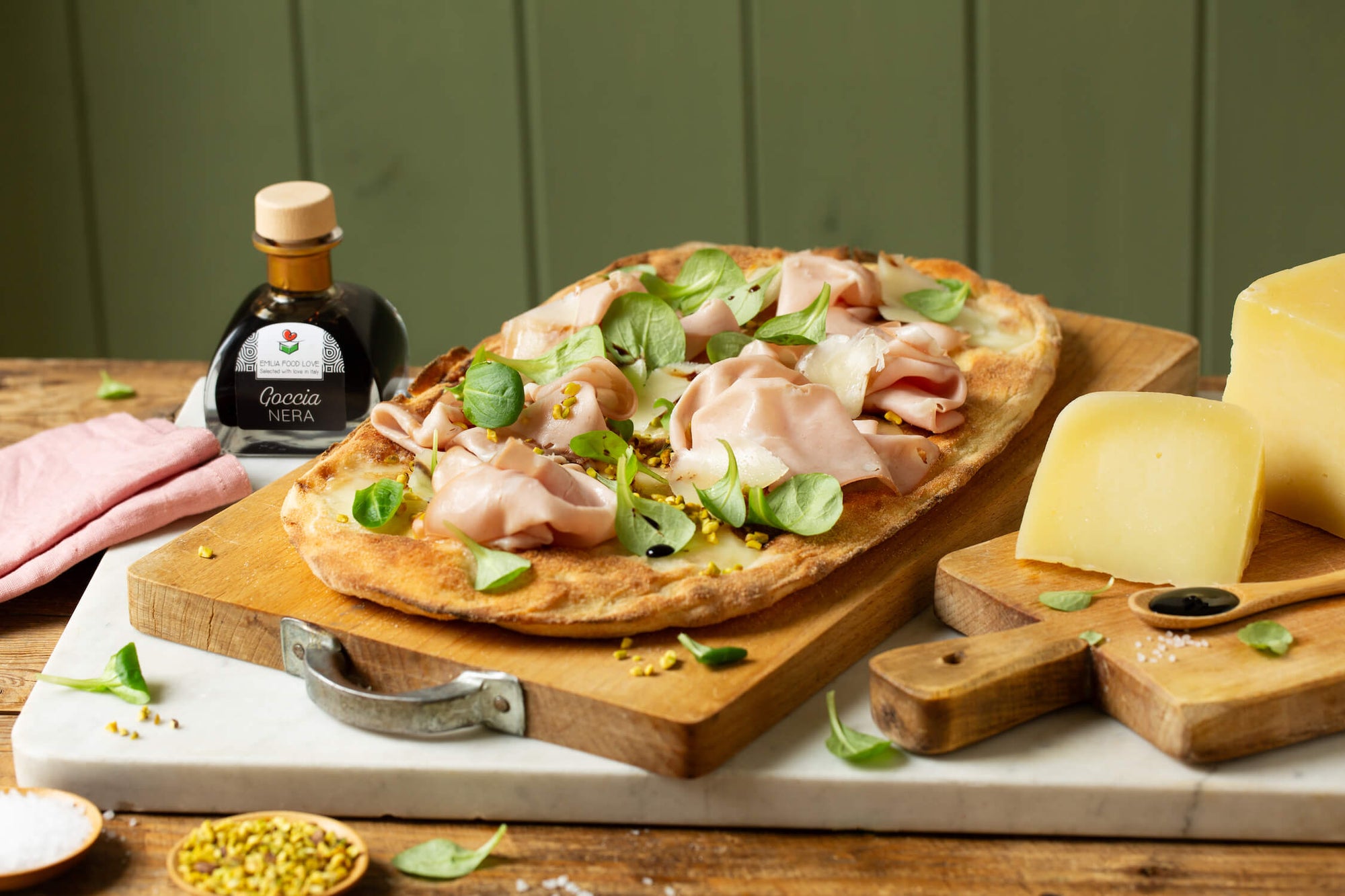 PINSA with mortadella, pecorino cheese, and balsamic dressing