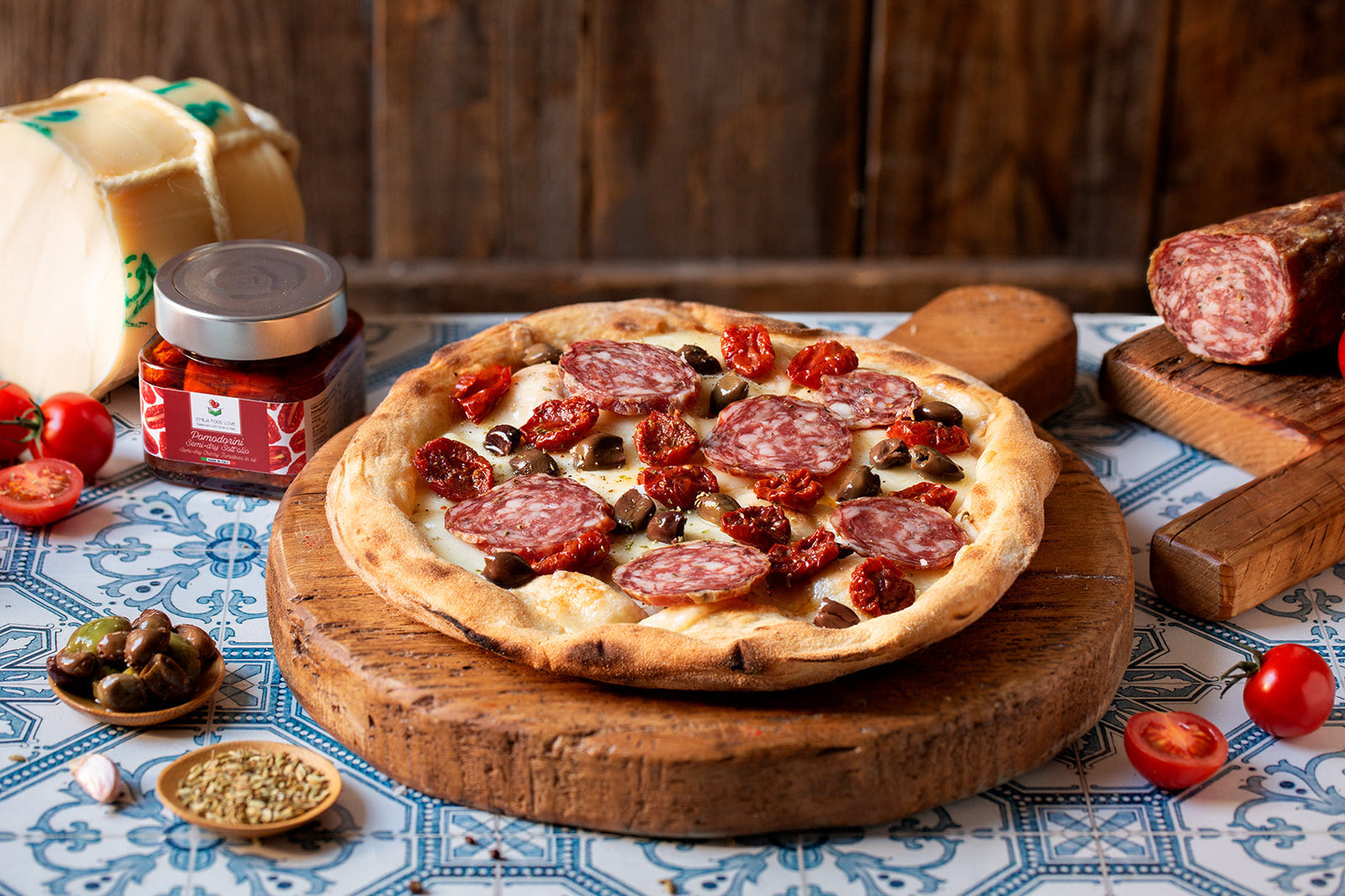WHITE PIZZA with Finocchiona, mild Provolone, mixed pitted olives and semi-dry cherry tomatoes