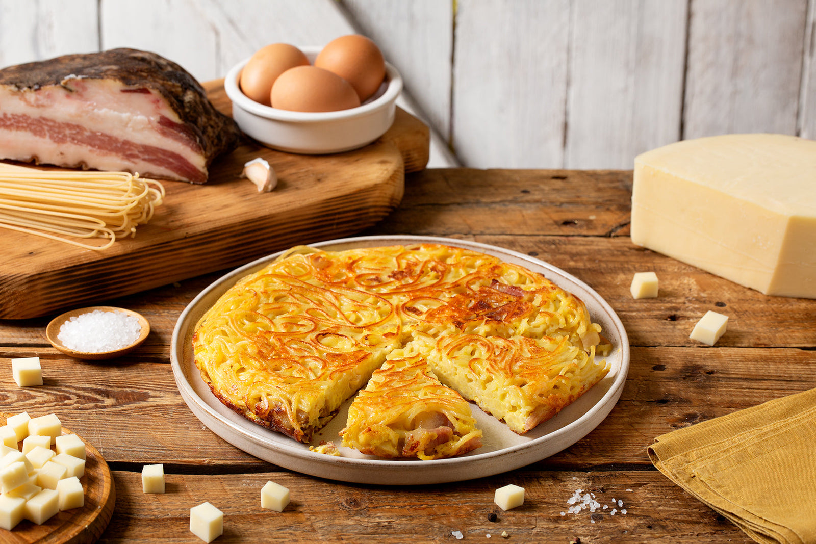 FRITTATA DI SPAGHETTI with guanciale and strong Provolone